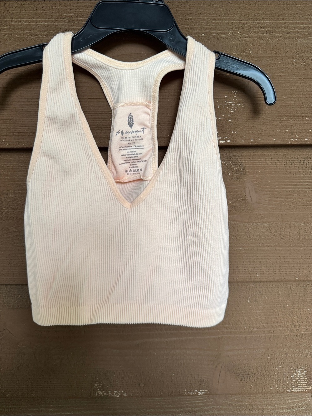 FP Movement by Free People Ribbed V-Neck Sports Bra in Light Peach size XS